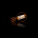 Lichtbron LED [A60] Filament Peer - 6,4x6,4x10 cm - 6W 2100K 450lm dimbaar - Amberkleurig Glas